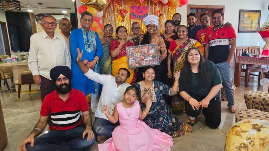 Priyanka Kundu Biswas (centre with chef’s hat on) with family and friends at a surprise party organised for her at her Gurgaon home