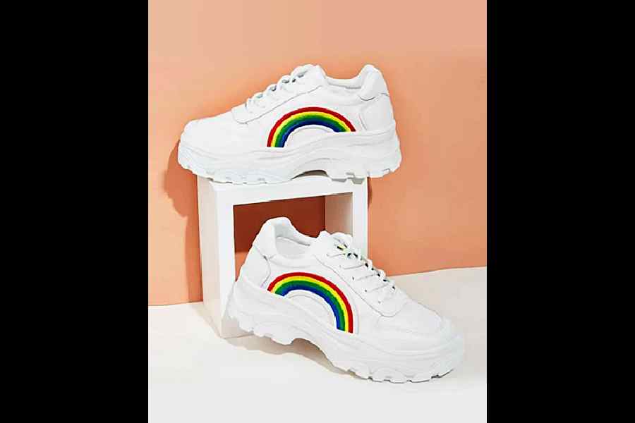 How stylish are these white sneakers with rainbow stripes? Team it with your dress or denims, this versatile footwear is all love. Rs 799 @myntra.com
