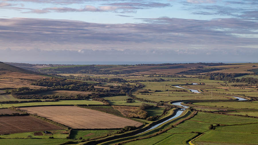 The open countryside of Sussex, with the River Ouse flowing through