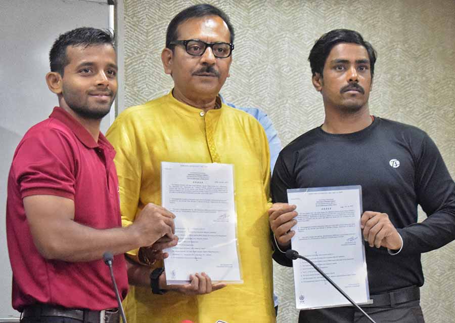 Two wrestlers Nandan Debnath and Ravi Jaiswal were handed over appointment letters by West Bengal sports minister Aroop Biswas on Thursday  