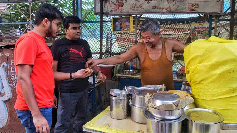 Dilip da has a steady flow of customers, some of whom come for the Thums Up Phuchka