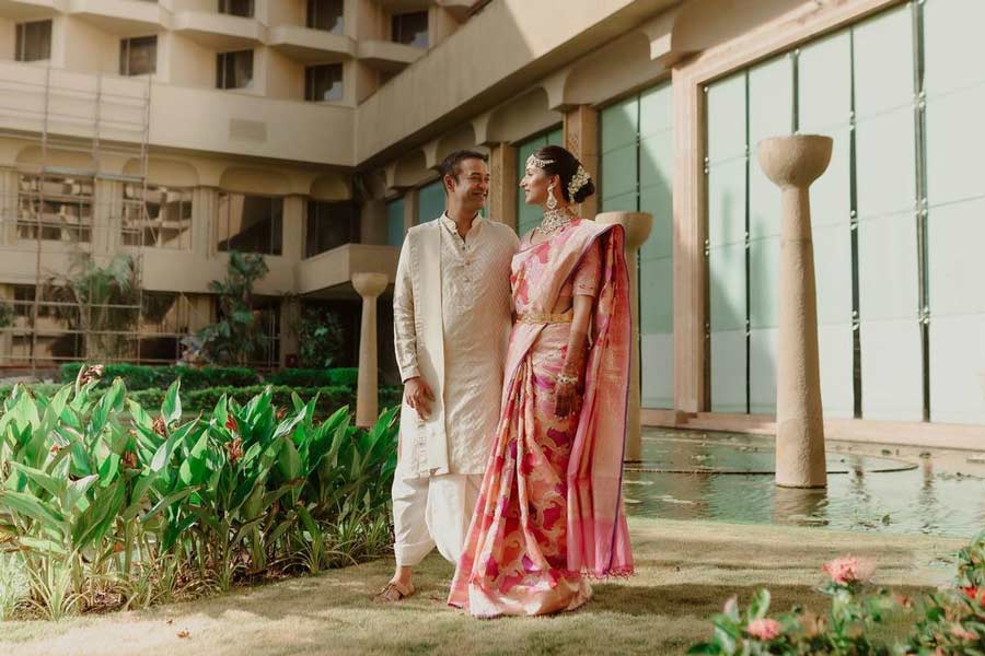 The newlyweds posed for a photo outside the wedding venue after the ceremony. 