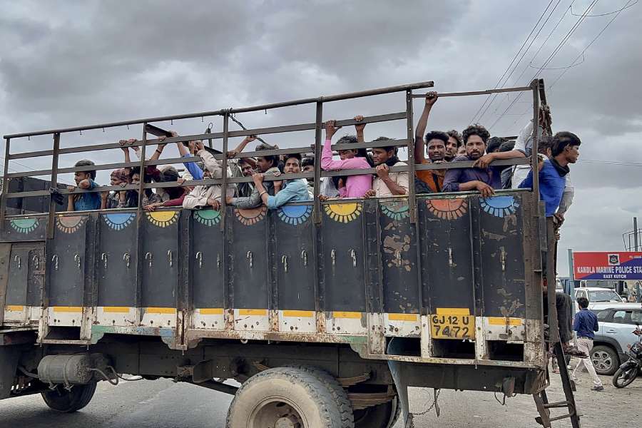 Villagers leave Jakhau village during evacuation ahead of cyclone Biparjoy’s landfall, in Kutch district. 
