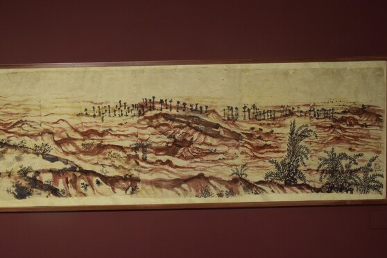 Khoai landscape by BinodeBehari Mukherjee. The red-brown colour is used to envision the curves and patterns of land. It also conveys a depressing barrenness of emotional scars and its never-ending motives.