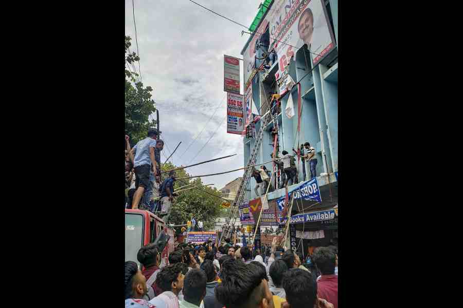 Students being rescued after a fire broke out at a coaching institute, at Mukherjee Nagar.