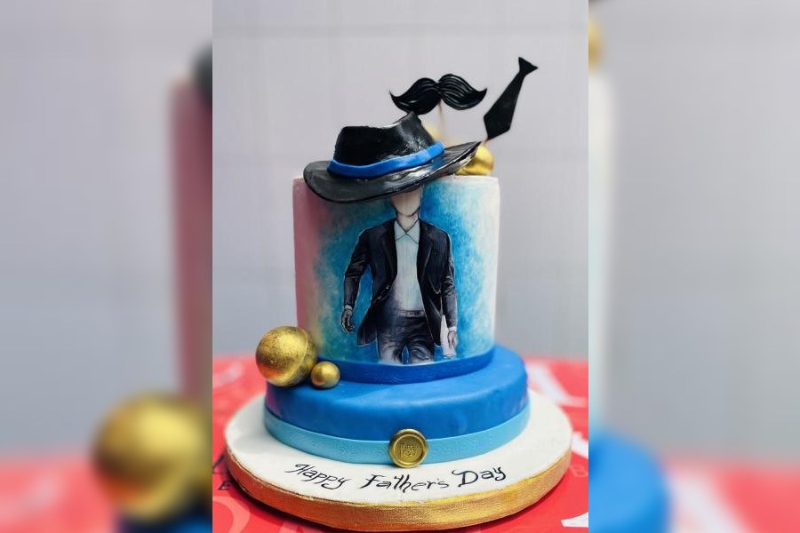 Customised Father’s Day Cakes: If you’re looking for something special for your dad, then this blue-and-black themed cake with a moustache, hat and suit motifs is a smart pick, and, definitely something your dad will remember. 