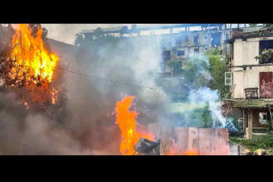 Flames engulf an old warehouse owned by a retired bureaucrat at Palace Compound in Imphal East district.
