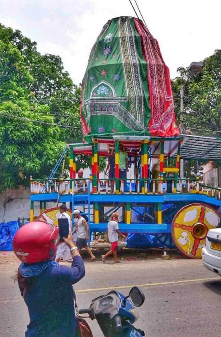 A biker clicks a photograph of Iskcon’s Rath which is being prepared for Rath Yatra. Rath Yatra will be celebrated on June 20, 2023  