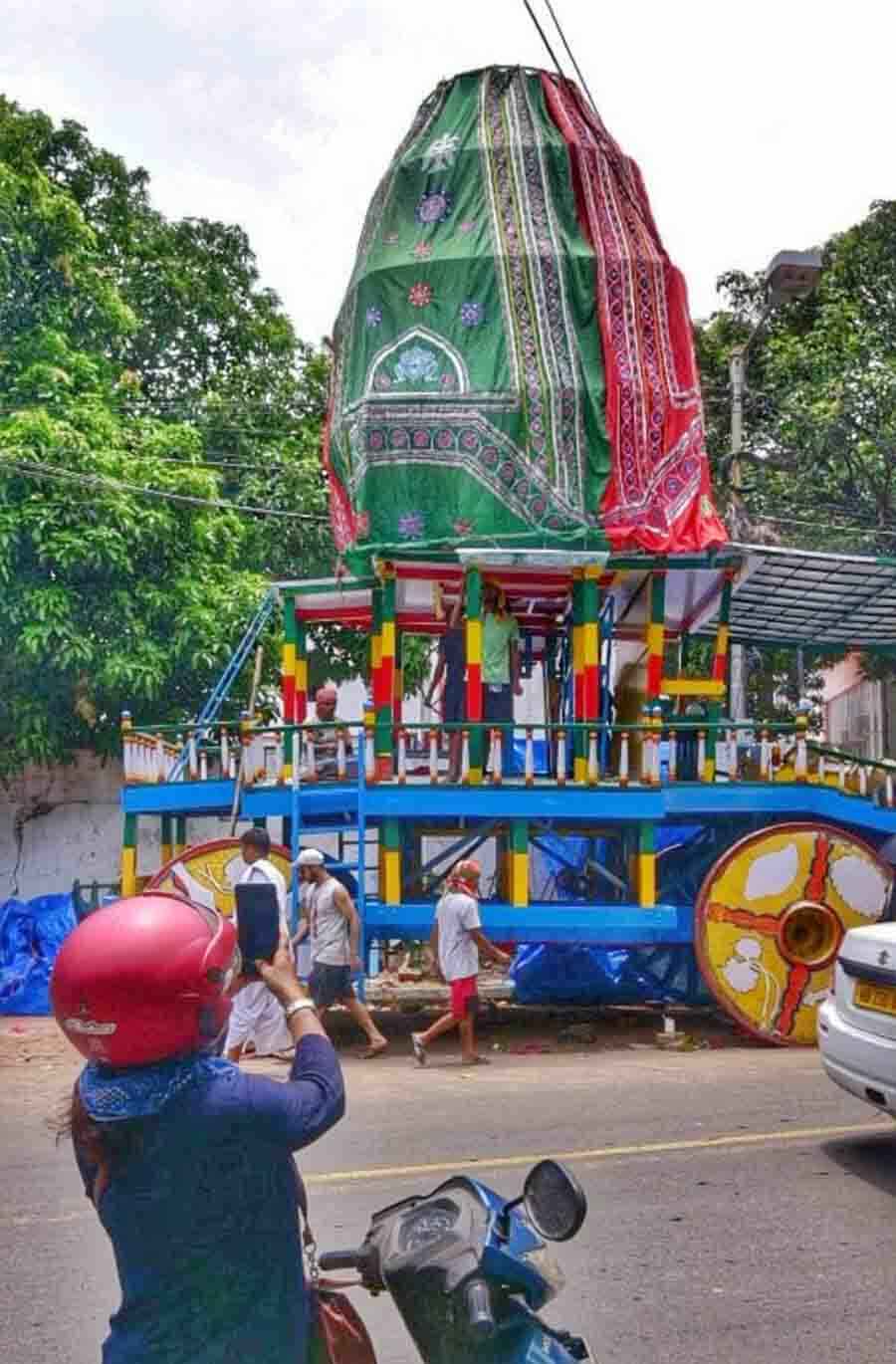 A biker clicks a photograph of Iskcon’s rath as it is prepared for Rath Yatra. Rath Yatra will be celebrated on June 20, 2023  S