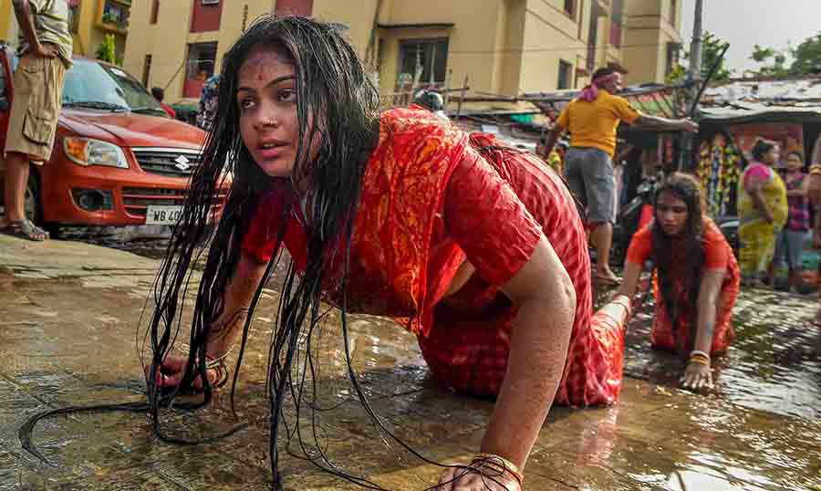 Devotees perform rituals during Sitala Puja in Kolkata on Saturday 