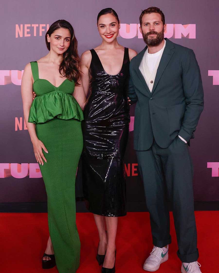 Alia Bhatt attended the event in a green outfit. She posed alongside her Heart of Stone co-stars Gal Gadot and Jamie Dornan.
