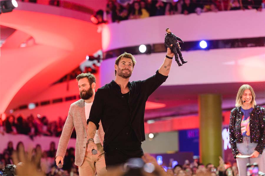 Stunt coordinator Sam Hargrave and actor Chris Hemsworth shared the stage. Hemsworth held a model of his character from Extraction in his hand.