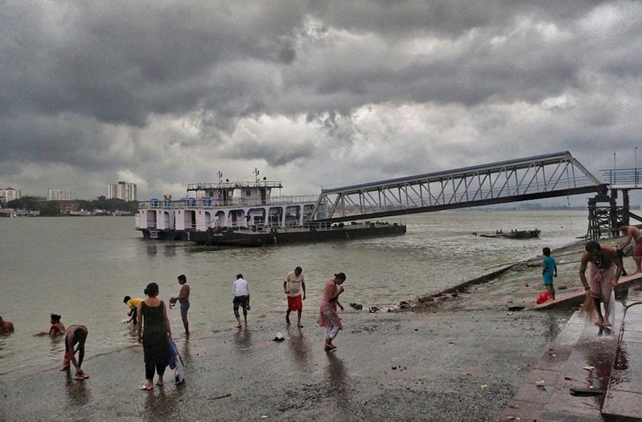 The southwest monsoon set in several districts of south Bengal on Monday. Districts of south Bengal including Kolkata have been reeling under heat wave like conditions for over a month. A spokesperson of the Indian Meteorological Department said conditions have become favourable for further advancement of the system over southern parts of the state in the next two-three days and cause moderate rainfall in different parts and heavy rains in some pockets. Overcast skies and light drizzle greeted the city on Monday morning. The mercury has dipped a little. The maximum temperature was recorded at 32.9 degrees celsius, one degree less than the average maximum temperature and the minimum 29.9 degrees Celsius  
