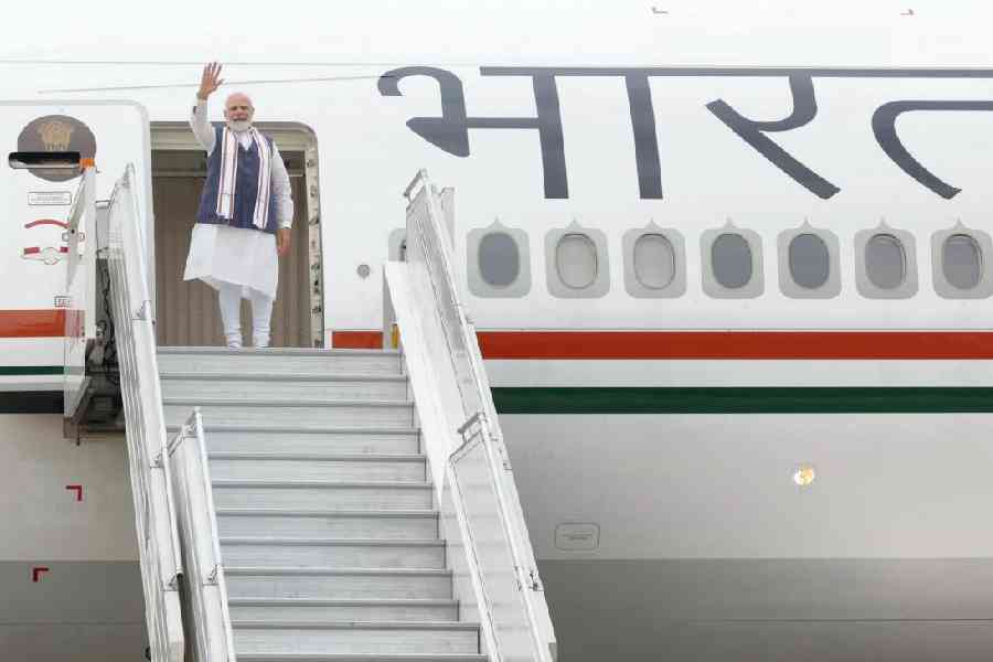 Prime Minister Modi boards a plane in New Delhi on Tuesday on his way to the US for a visit that includes a state dinner on Thursday.