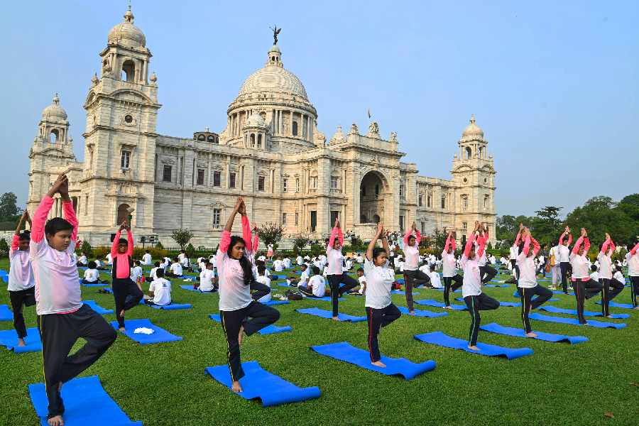 Students perform yoga on the premises of Victoria Memorial on the International Day of Yoga in Calcutta. The first International Day of Yoga was commemorated in 2015 and has since then been marked with several sessions and events highlighting the benefits and universal appeal of Yoga at the UN, Times Square and iconic locations across the world.
