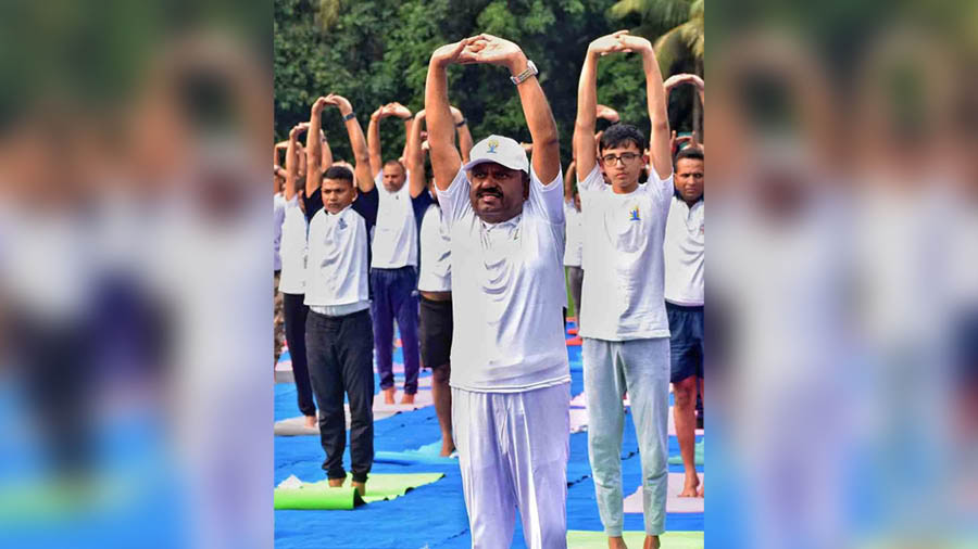 Governor Dr CV Ananda Bose takes part in a yoga session on the lawns of Raj Bhavan on International Yoga Day on Wednesday