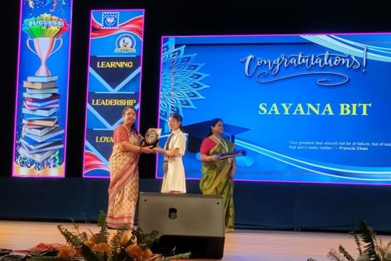 Sayana Bit felicitated by Ms Atri Mitra. Headmistress (Middle & Senior).