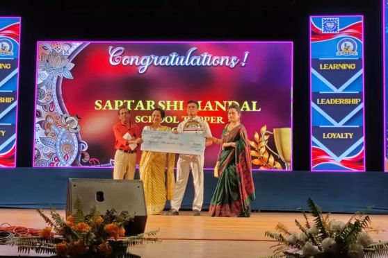 Saptarshi Mandal & his parents (ISC 2023 School Topper) receive a cheque, certificate and medal from Principal Ms J Biswas.
