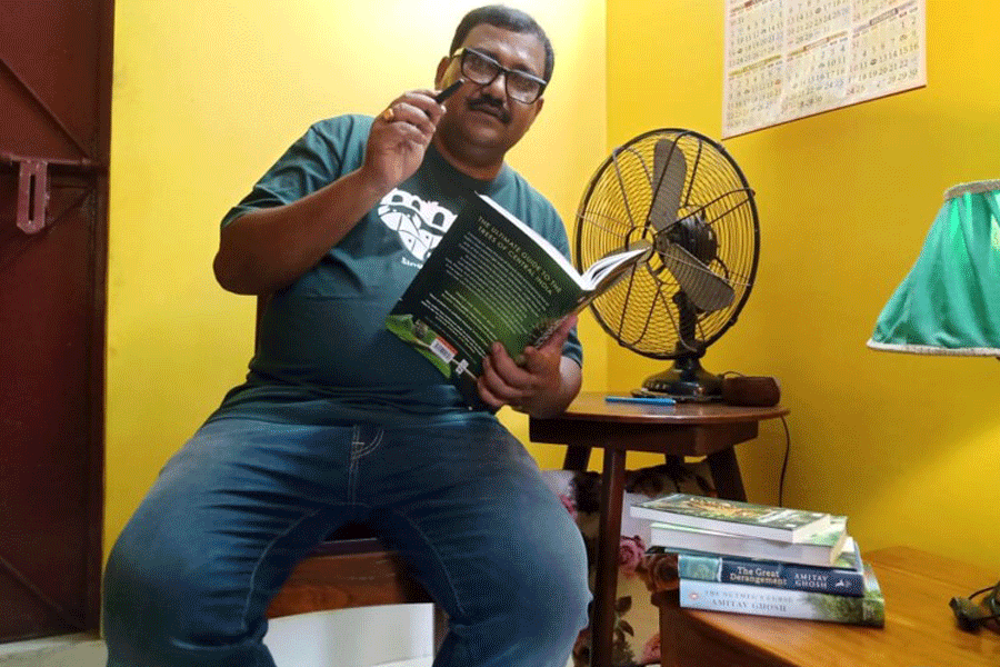 Sandip Kumar Basak with a botany book.
