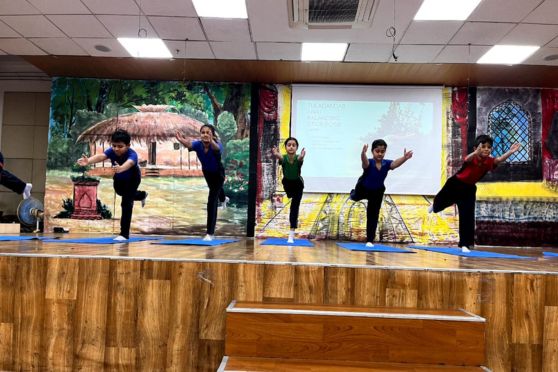 A demonstration of yoga by the students of Sri Sri Academy on World Yoga Day