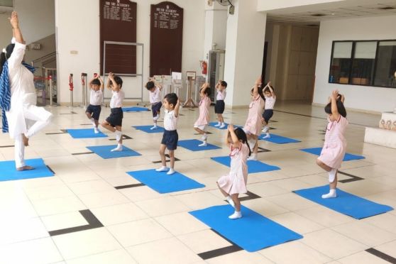 Younger students of the school attending a yoga session 