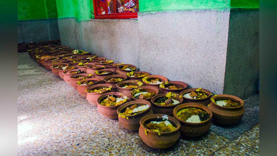 The pots are laid out inside the mashir bari temple 