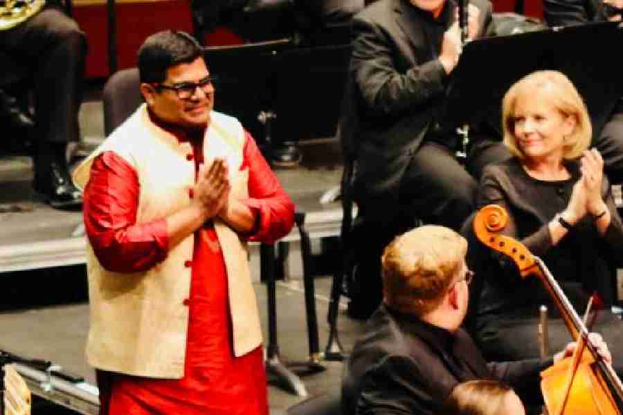 Sutanu Sur receives a huge applause from the audience and the orchestra after his performance with the Fox Valley Symphony Orchestra