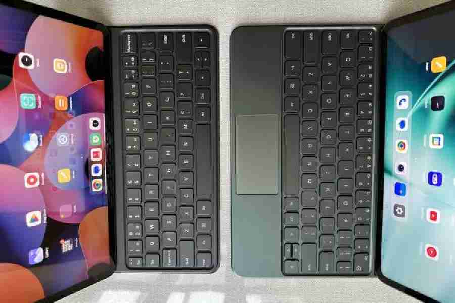 The keyboard on the OnePlus Pad (right) is slightly better and has a trackpad