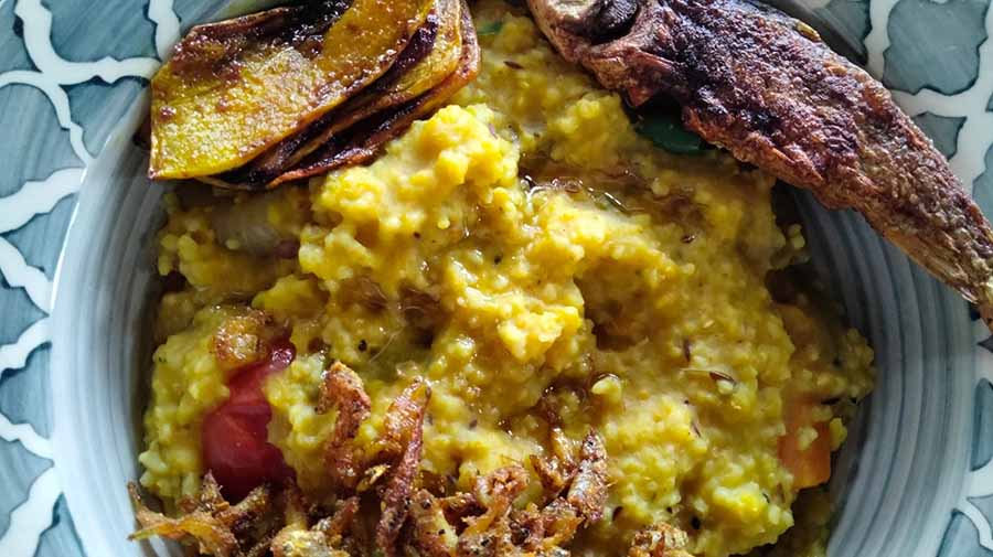 A steaming plateful of khichuri with a dollop of butter on top, crunchy fritters and 'maachh bhaja' to give Kolkatans the real feel of monsoon
