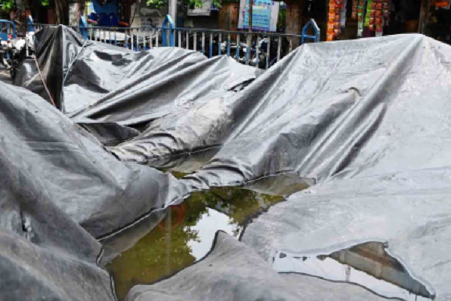 Water accumulated on a plastic sheet covering seized cars in front of Topsia police station on Tuesday