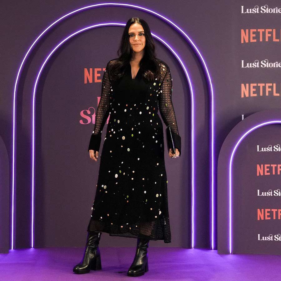 Neha Dhupia turned up in a shimmery black dress paired with black boots for the premiere.   