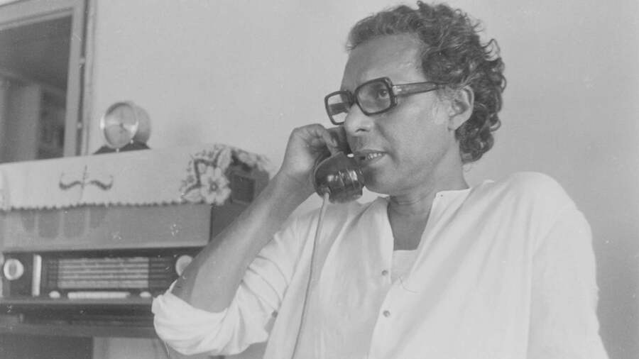 Mrinal Sen in front of the family radio at home