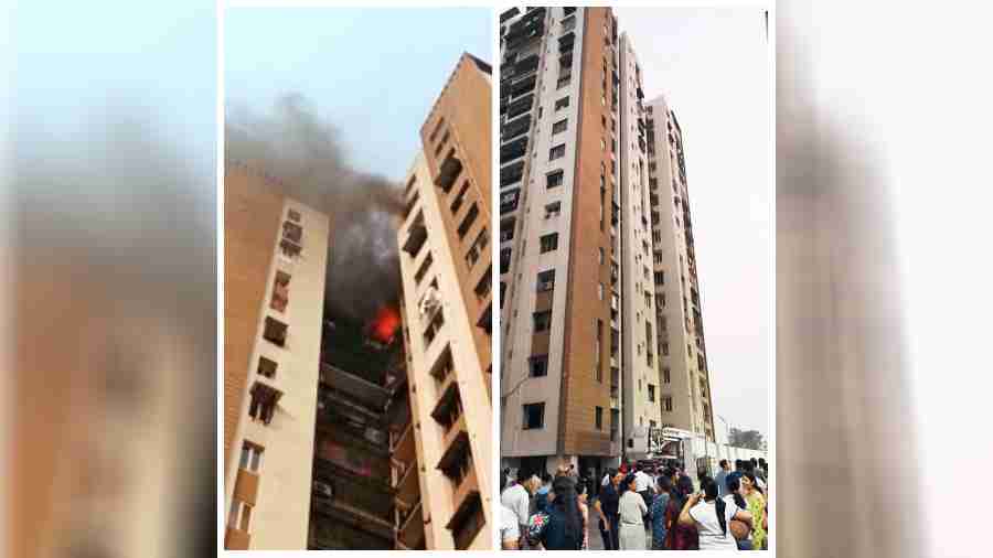 The fire in the 16th-floor flat at Diamond City North in Nagerbazar on Wednesday; (right) residents gathered outside the fire-hit tower of the housing complex. 