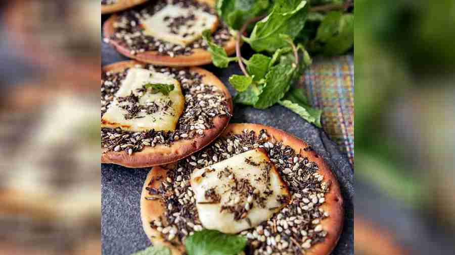 Halloumi Pizza: These little bites with zaatar and baked halloumi are the perfect appetizer for any party. We love how delish they were without any additional toppings. 