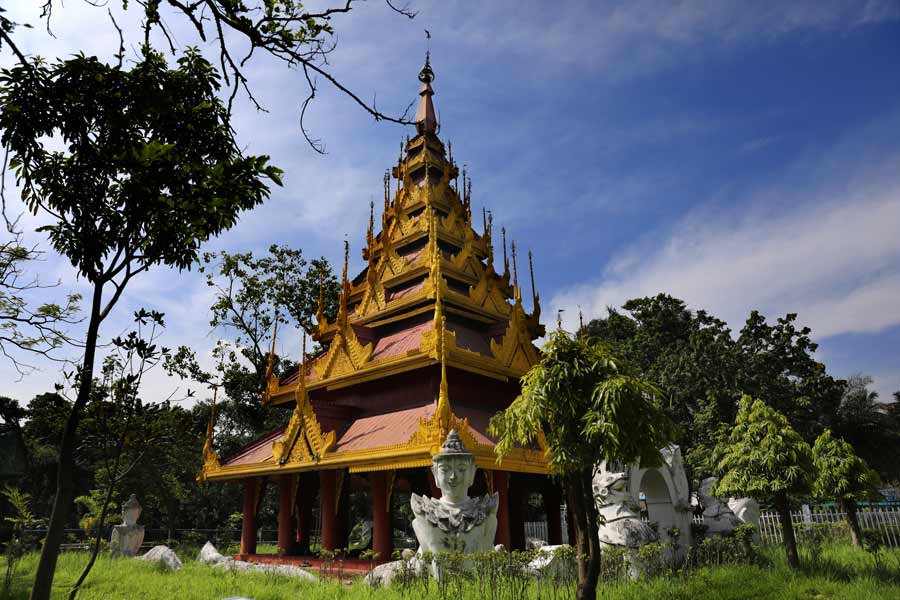 A decorated pagoda imported from Burma sits inside the garden