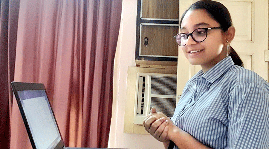 Student of Birla Bharati school take online lessons.