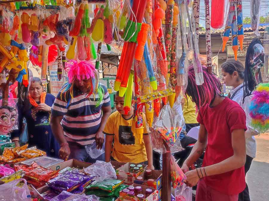 A crowded north Kolkata shop selling ‘pichkaris’ and colours for Holi 