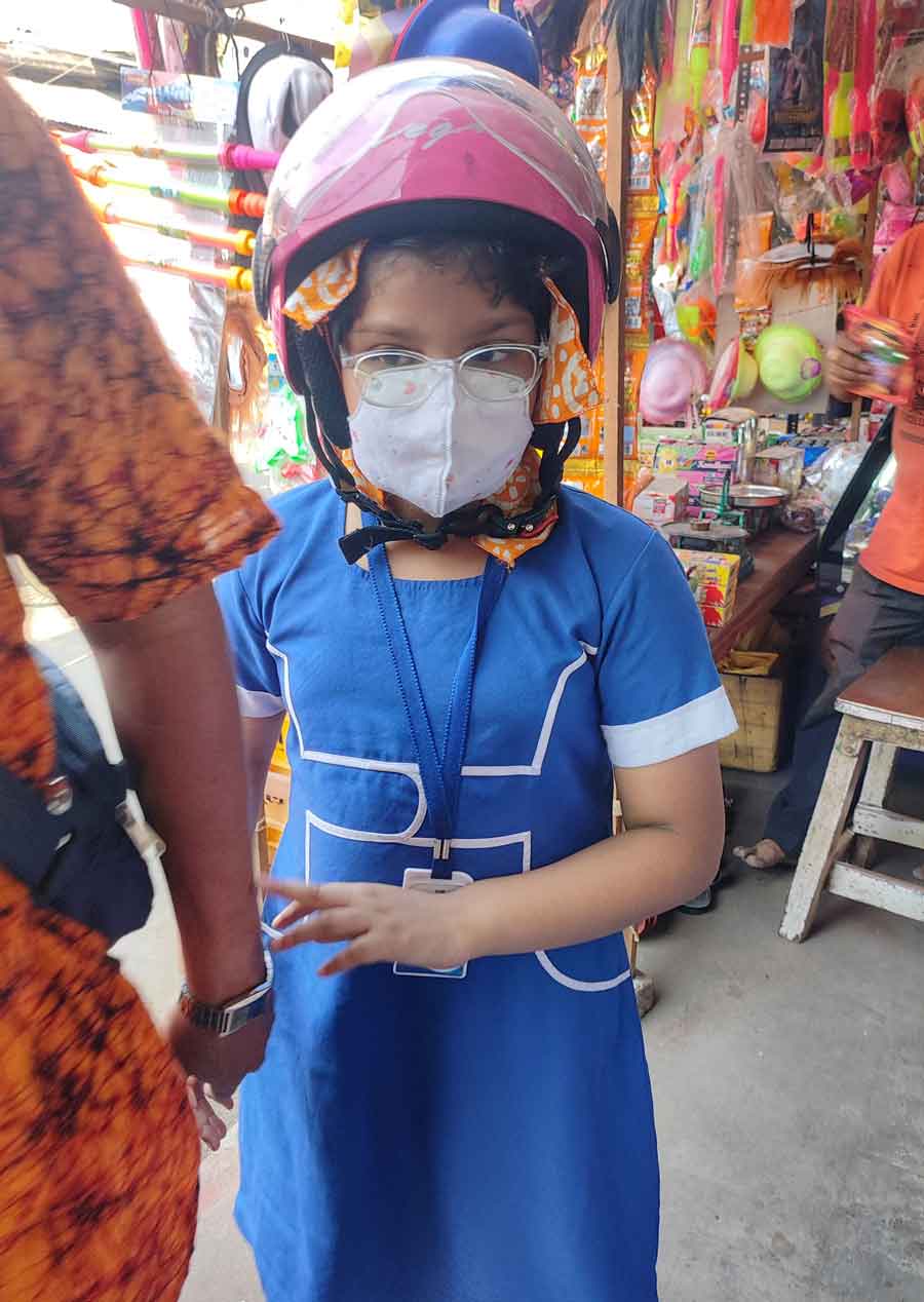 A school student wears a mask as Adenovirus cases register a rise