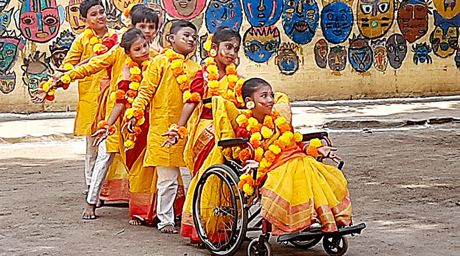 Children with special needs from the Indian Institute of Cerebral Palsy celebrate Basanta Utsab.