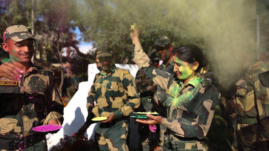 Border Security Force (BSF) personnel celebrate the Holi festival, near India-Pakistan border in Samba district.