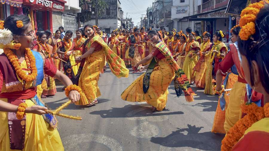Students dance during 'Basanta Utsav' celebrations ahead of the Holi festival, in Murshidabad district in West Bengal.