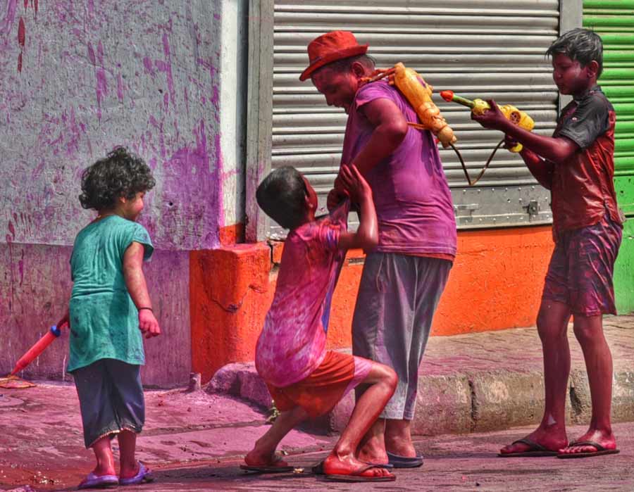 Kids celebrate Holi with colours on Muktarambabu Street in central Kolkata on Wednesday