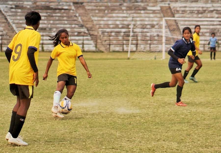 Players in action at a football match at Rabindra Sarobar stadium on the occasion of International Women's Day. Sampurna Cup was organised by the Indian Football Association and the International Organisation of Human Rights