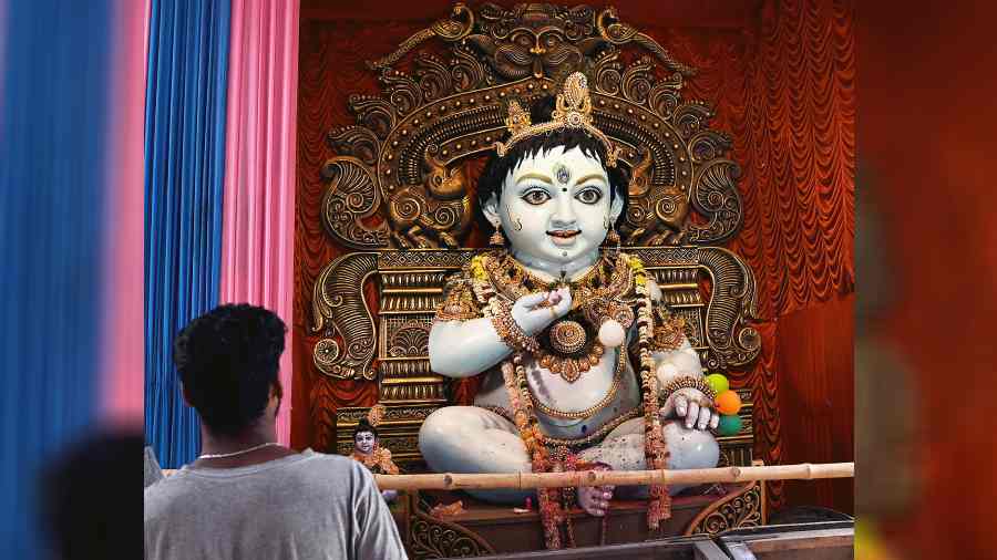 A Gopal idol at a pandal in Kumartuli for Dol Purnima.