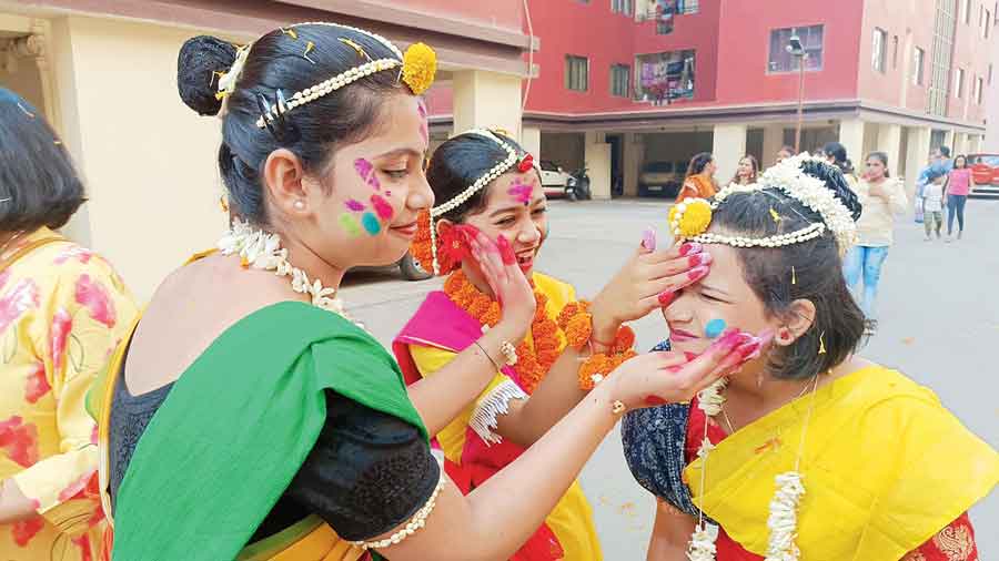 Girls play with colours at Greenfield Heights in New Town