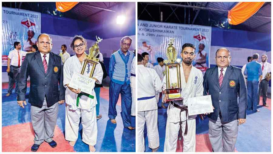 Champions Brishtisnata Dutta, in ladies open kumite, and Shankar Singh, in men’s open kumite, pose with their trophies. To the extreme left is Prasenjit Saha, who heads the state kyokushin karate association