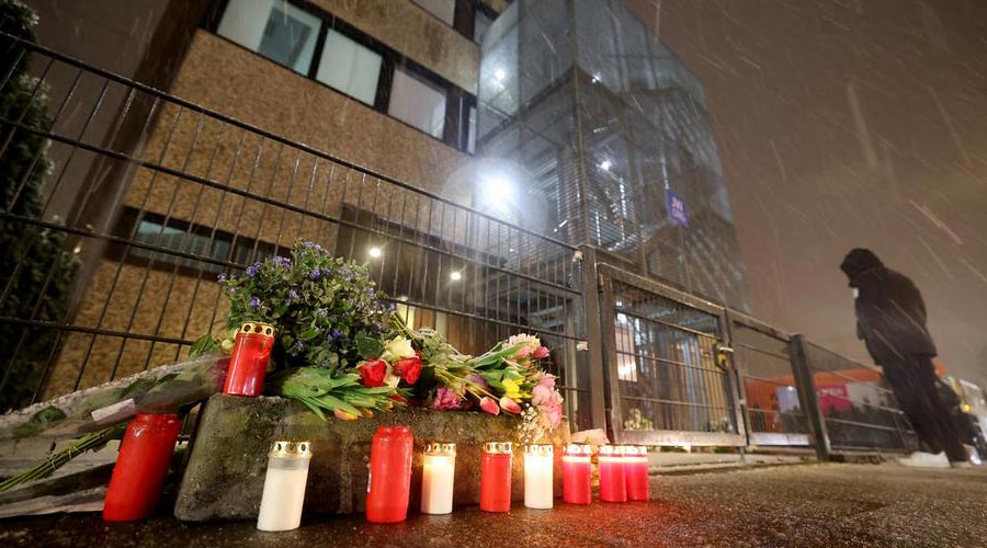 Lights and flowers laid in front of the building of Jehovah's Witnesses in the Alsterdorf district, Hamburg.