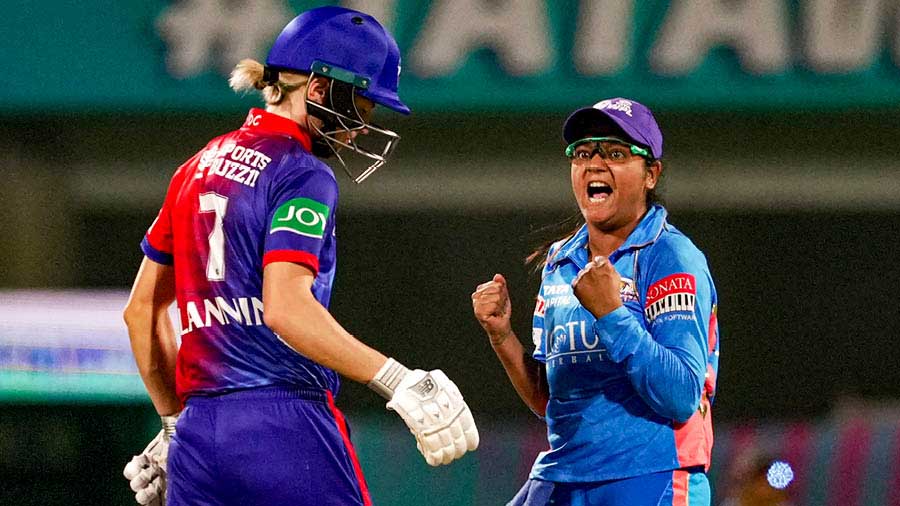 Mumbai Indians’ Saika Ishaque celebrates a wicket during a 2023 Women's Premier League match against the Delhi Capitals