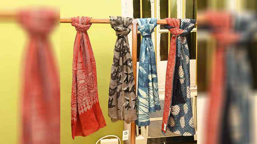 A colourful collection of zero-waste tagai scarves and silk and linen scarves printed in ajrakhtechnique.  