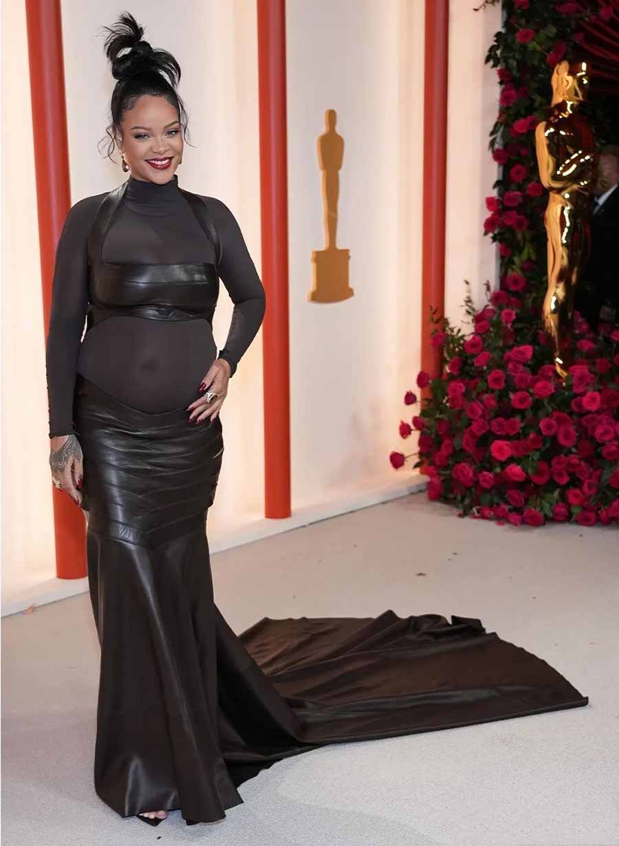 Rihanna showed off her baby bump in a brown leather bralette and skirt with a trail, worn over a high-neck sheer bodysuit. Moussaieff High jewellery completed the look.